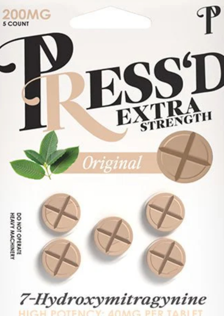 Blister packs of kratom capsules showing 7-hydroxymitragynine on the label