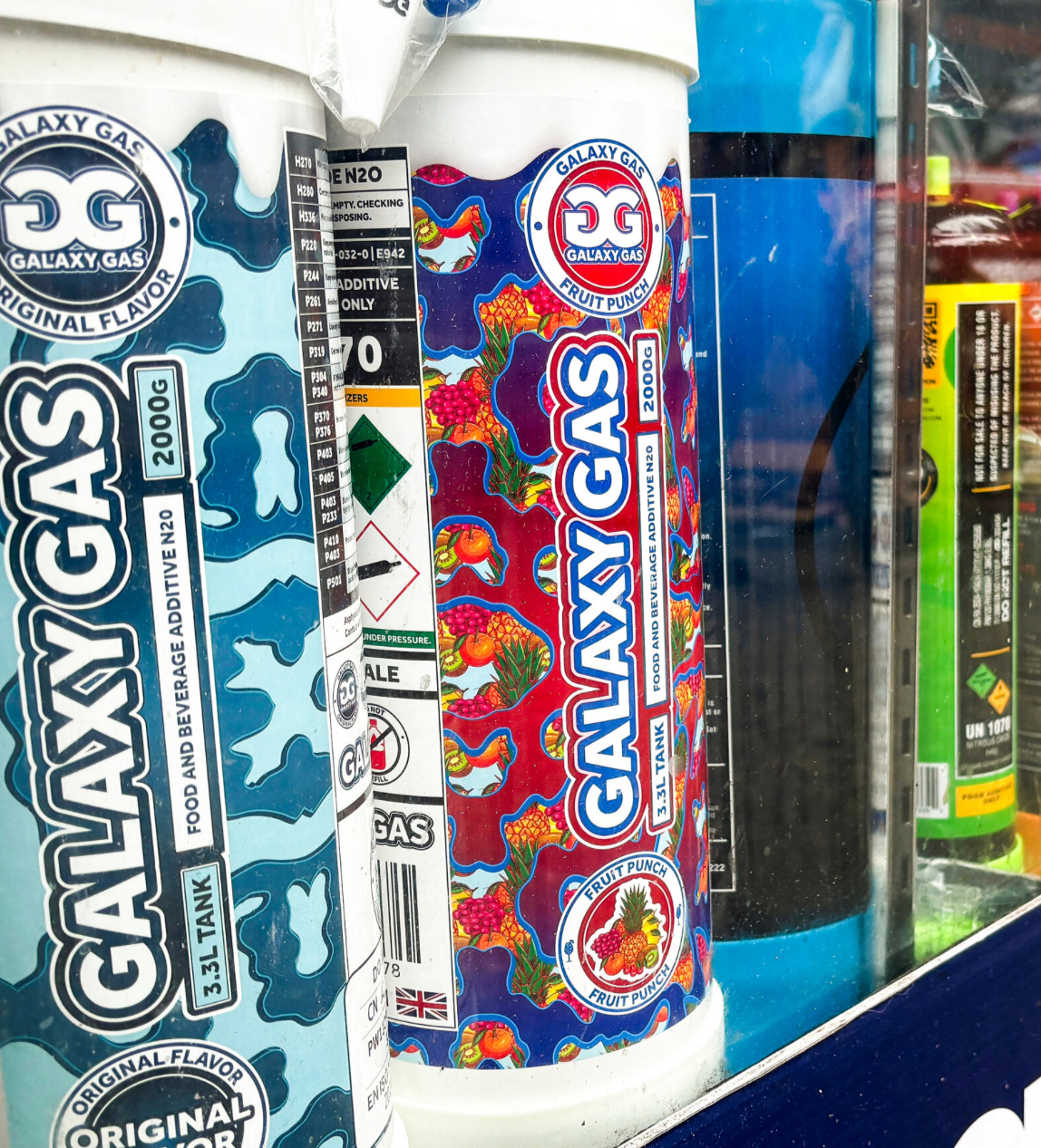 Large nitrous oxide cylinders displayed for retail sale